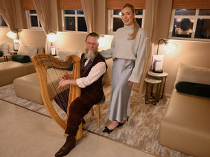 A harpist playing the harp, in the Low Wood Bay Resort  & Spa resort.