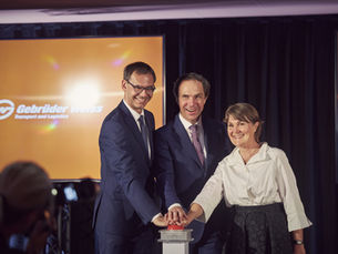 Gebruder Weiss, three top staff celebrate the opening of a Logistics and IT Center in Vorarlberg, Austria.