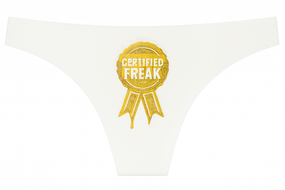 Thumbnail: Women’s Kinky Couture seamless thong featuring a gold “Certified Freak” award-ribbon design on the front. Available in red, b