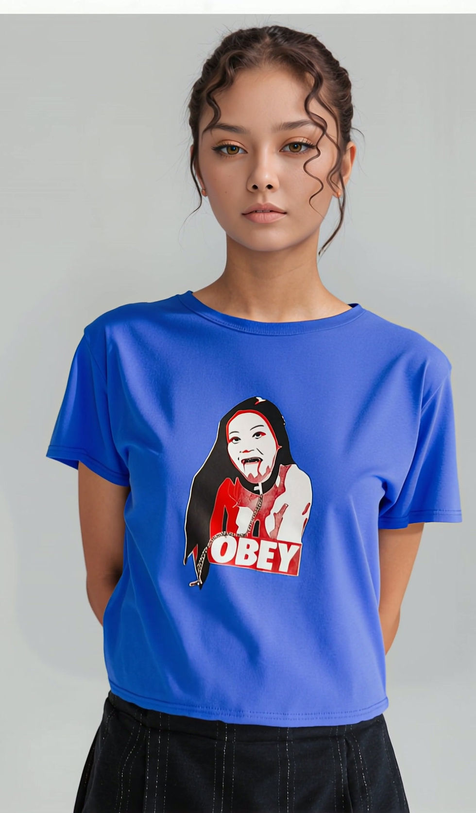 Kinky Couture OBEY BDSM-themed T-shirt — blue and red spoof design with submissive girl artwork and real metal chain accent