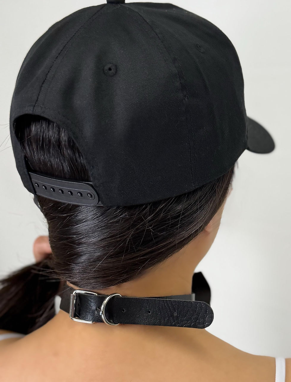 Thumbnail: Back view of Kinky Couture hat with adjustable strap and black satin choker.