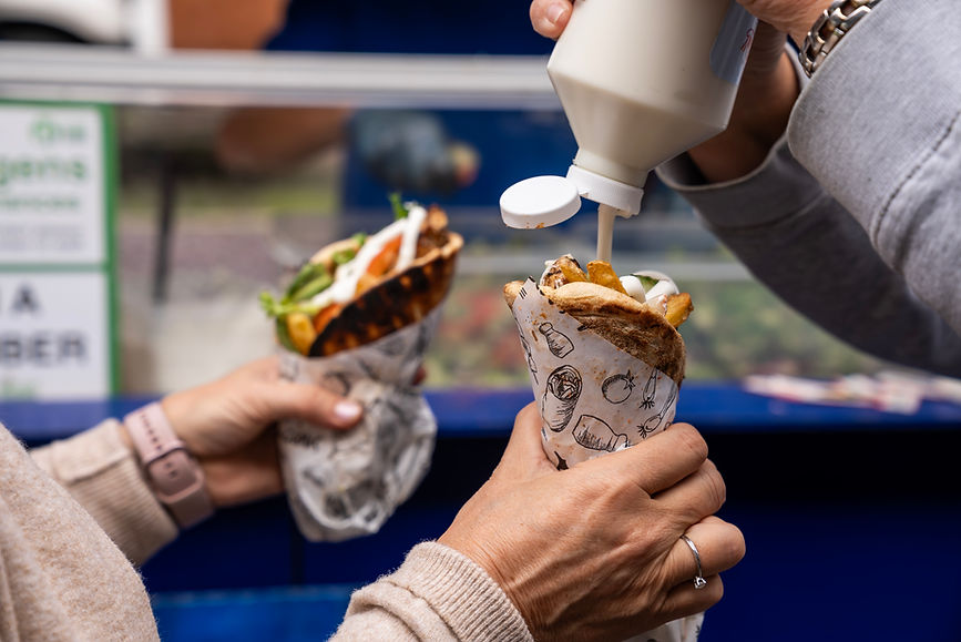 Greek street food gyros wraps with sauce served at a London street food market by Hide & Greek.