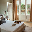 Elegant double bedroom with panoramic views of the Val d’Orcia, Villa Oliveto near Pienza,