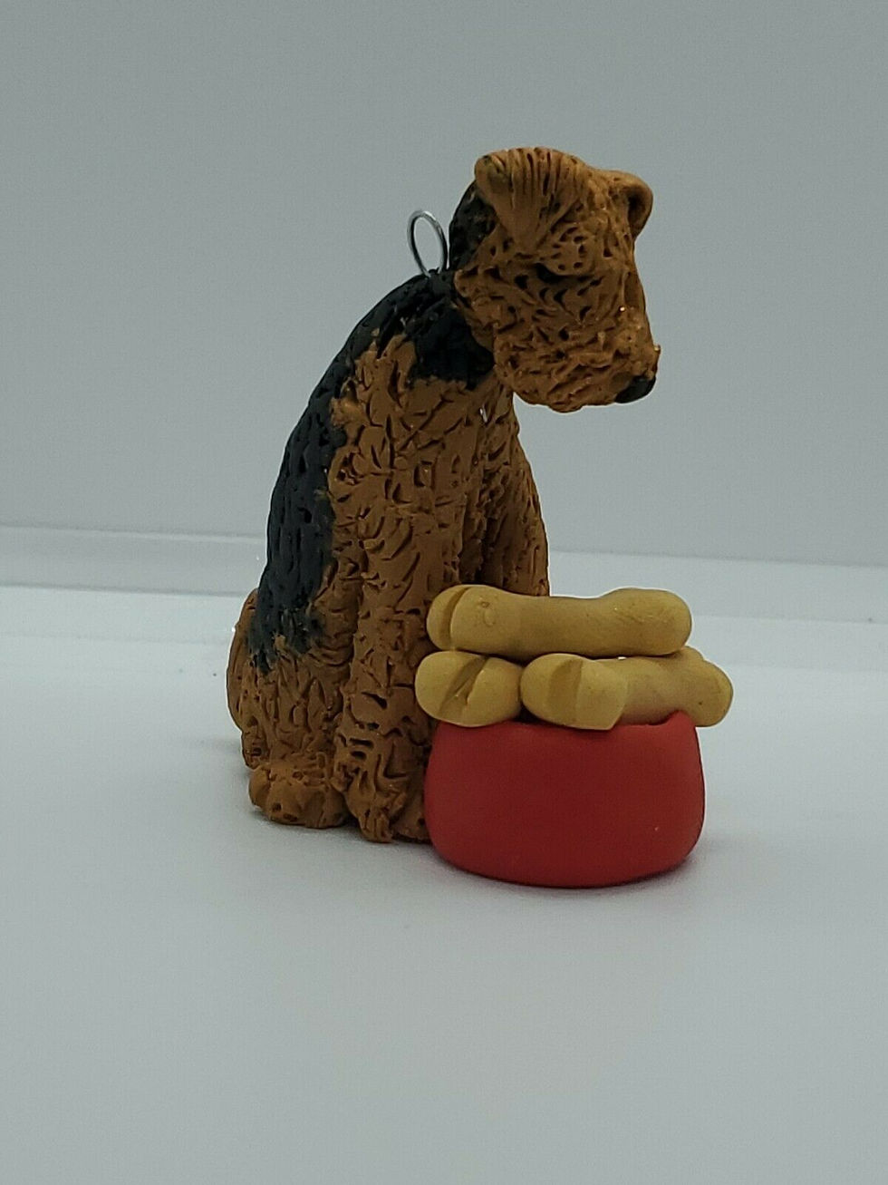 Thumbnail: AIREDALE With Dog Dish of Bones Christmas Ornament CAN BE PER