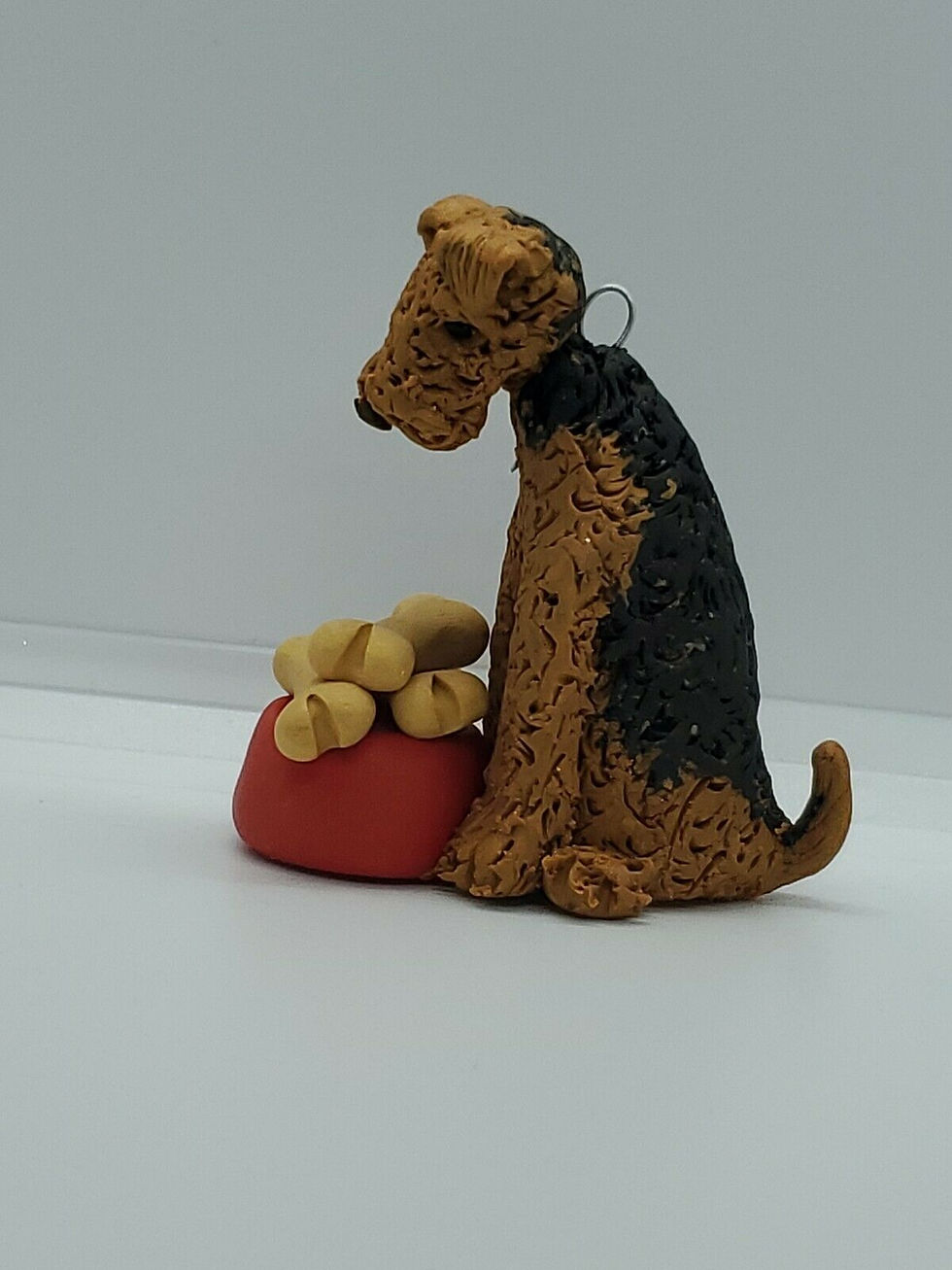 Thumbnail: AIREDALE With Dog Dish of Bones Christmas Ornament CAN BE PER