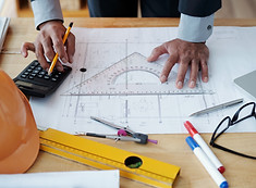 hands-unrecognizable-male-architect-working-technical-drawing-using-calculator.jpg