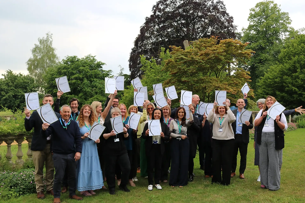 Wiltshire College & University Centre staff proudly display their professional development certificates.
