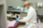 Dentist performing examination on a patient in a clinic