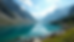 High angle view of alpine lake nestled in a glacial cirque surrounded by rocky peaks