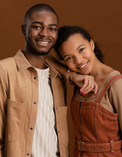Portrait of a joyful couple smiling together outdoors, embodying happiness and togetherness