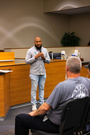 Councilor Archie speaking at an event in the Council Chamber