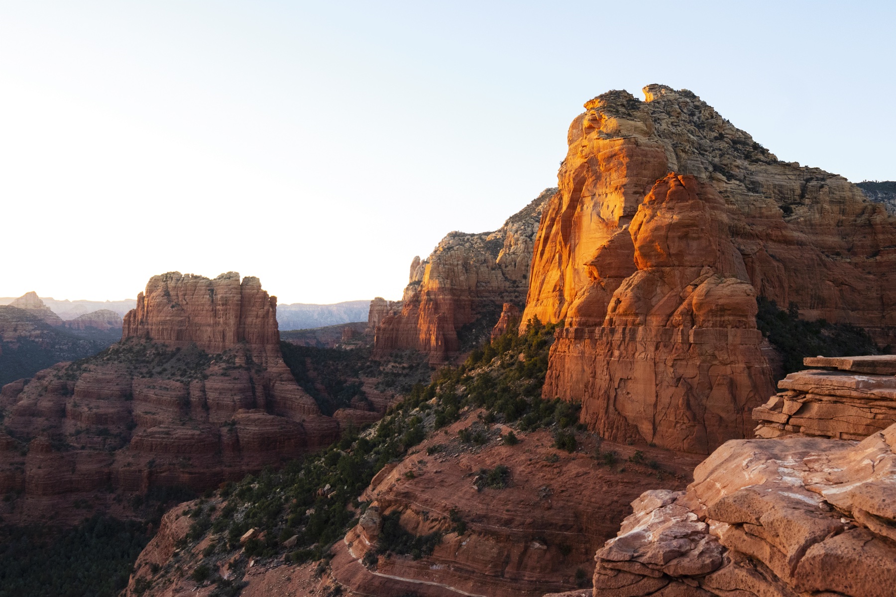 Warm evening light on Steamboat Rock and the red rock formations of Sedona