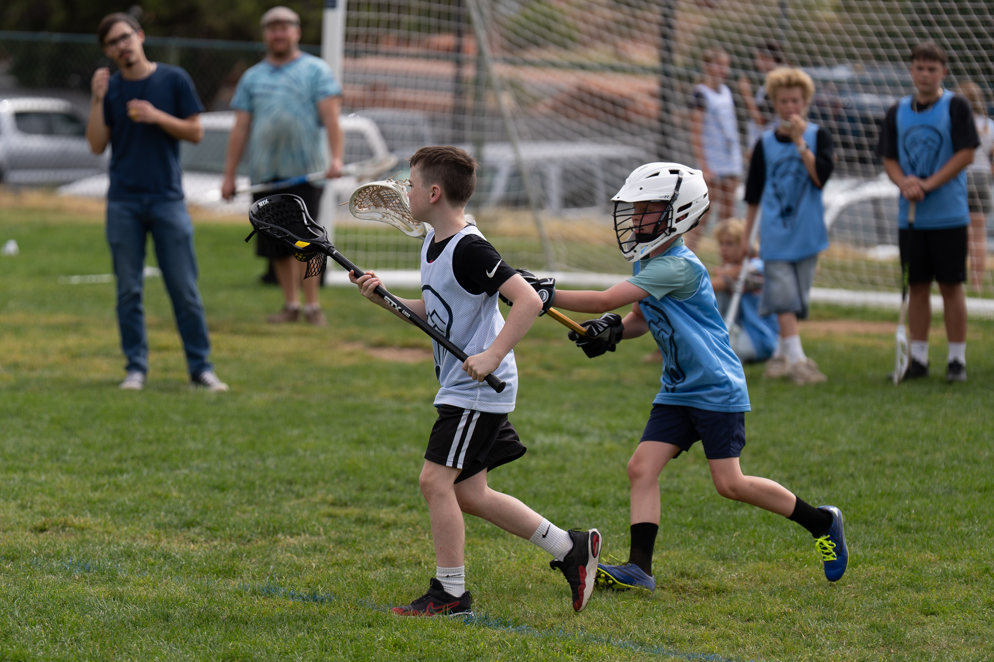 Prescott Outlaws player Jack Whitehead carrying the ball as Riley De Alva of Flagstaff guards him