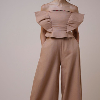 Bustier with peplum and sculpture,  palazzo pants from Ghana kente and linen
