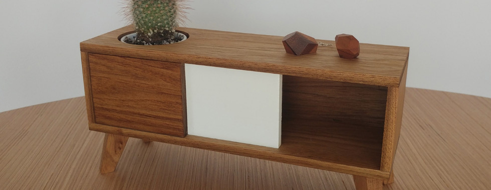 Mini console with a pair of earrings for scale