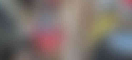 Showing a plastic coffee bucket screwed to the side of the stand with misc pieces in it