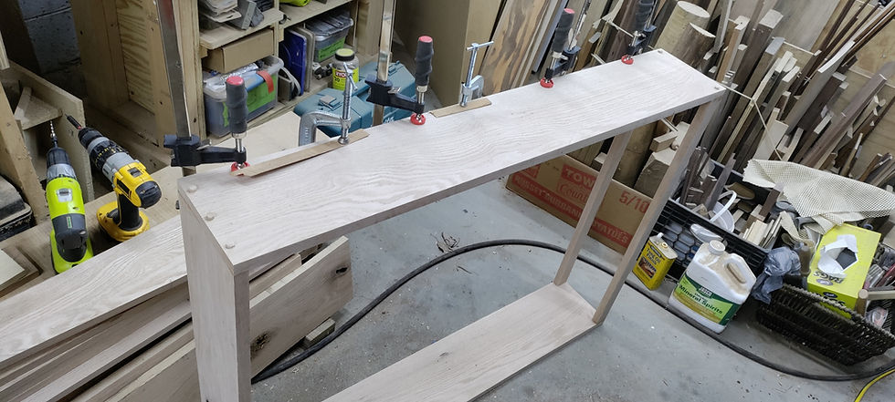 Unfinished bookshelf box laying on its side while being built