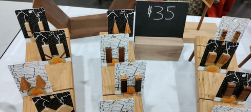 A collection of earrings on individual cards displayed out on a table