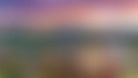 A sunset with Main Street in the foreground and mountains in the background