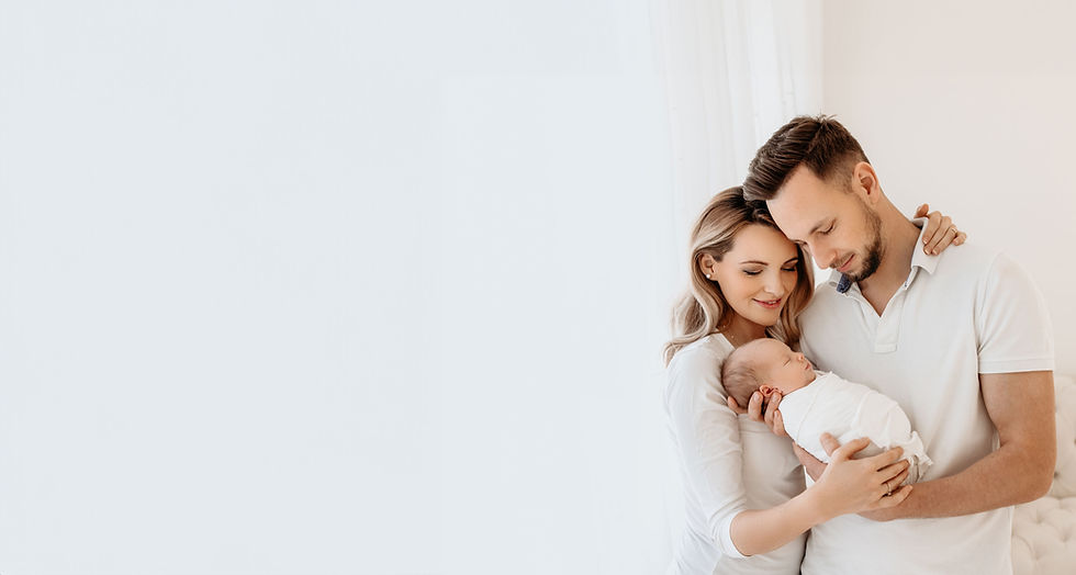 Happy parents holding their newborn baby