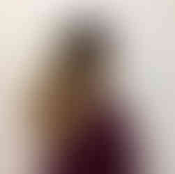 a woman with long hair and balayage ombre highlights on a long layered haircut