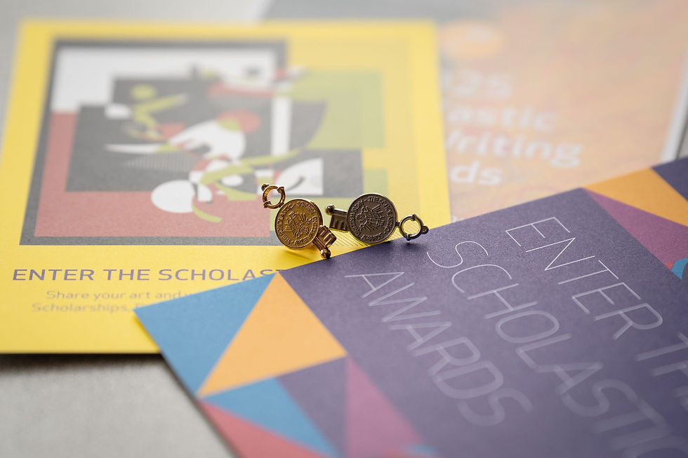 Gold and silver keys on colorful flyers with text "Enter the Scholastic Awards." Bright, geometric designs and abstract art create a vibrant background.