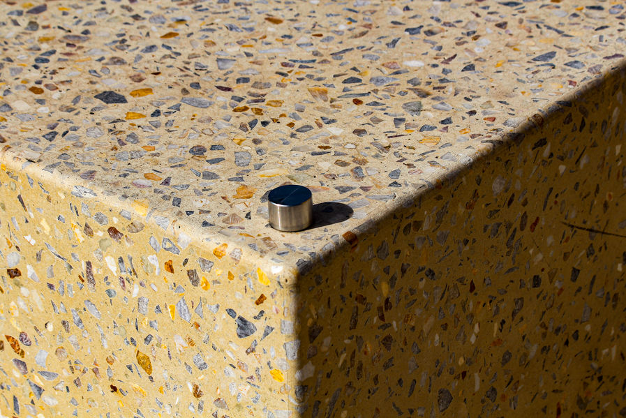 Block of coloured concrete with shadow on one side.