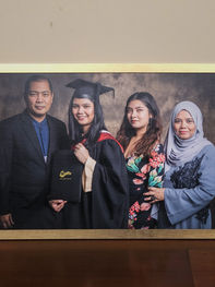 Custom frame in gold for family portrait by Pristine Print.