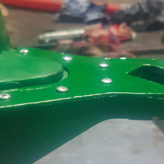 Toy cart in need of hitch repair.