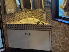Old bathroom vanity with mirror.