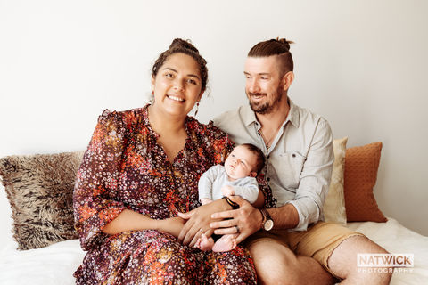 Parents with newborn baby at Natwick Studios for Newborn Portraits.