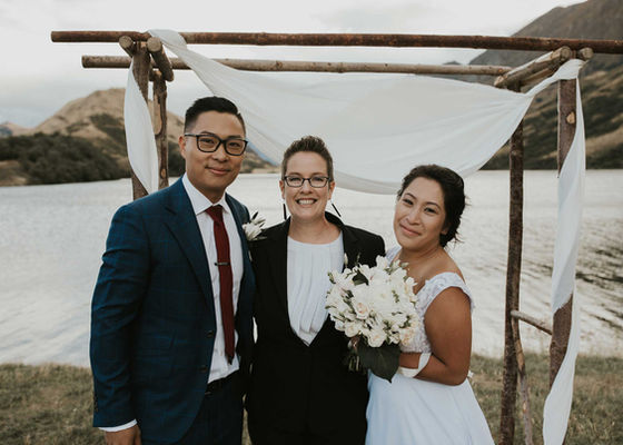 celebrant and couple at Moke Lake Queenstown after their wedding ceremony