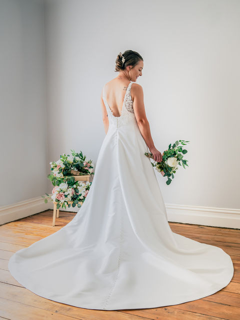 Bride poses in studio setting, hair and makeup by Finesse Hair and Beauty Gore