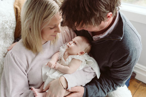 Parents with newborn baby at Natwick Studios for Newborn Portraits.