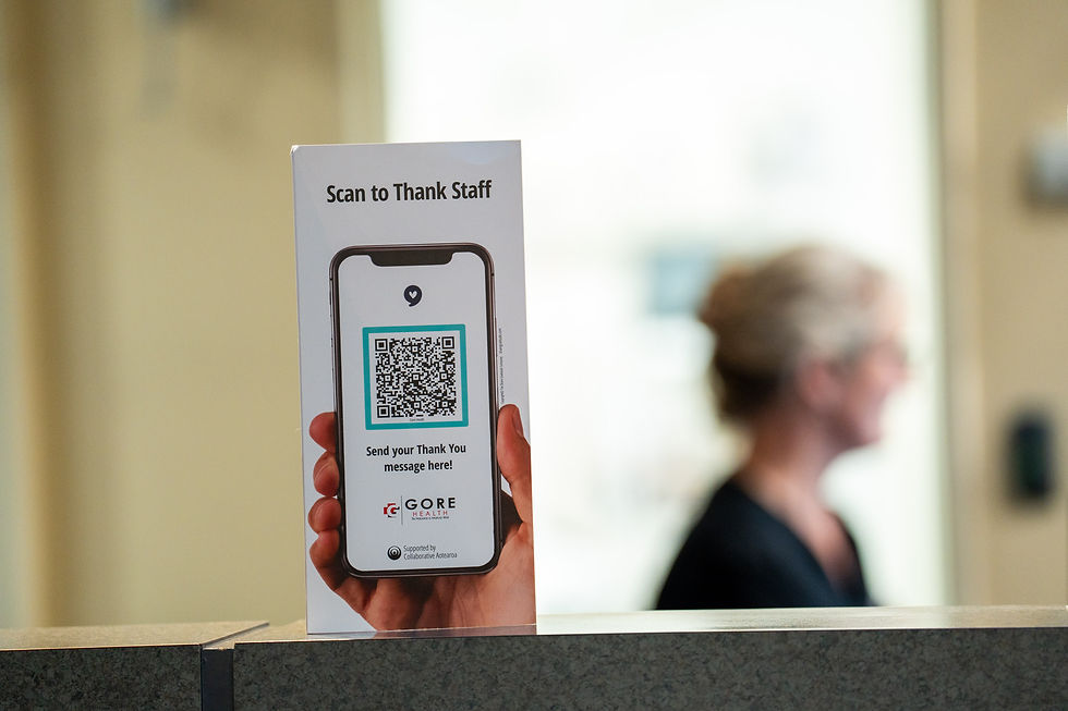 Scan to Thank Staff card on the counter of the Gore Hospital Emergency Department.