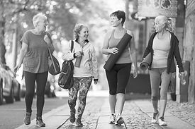 Group of midlife women walking to Pilates Class