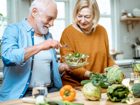 Senior citizens enjoying a healthy salad