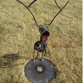 Handcrafted metal sculpture with branch-style antlers and red nose, created from reclaimed materials by The Welding Carpenternear Bricon in Mid Wales