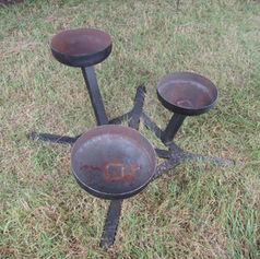 Three-tier metal structure with circular bowls, possibly used as a decorative garden stand or fire pit, handcrafted by The Welding Carpenter in Kent