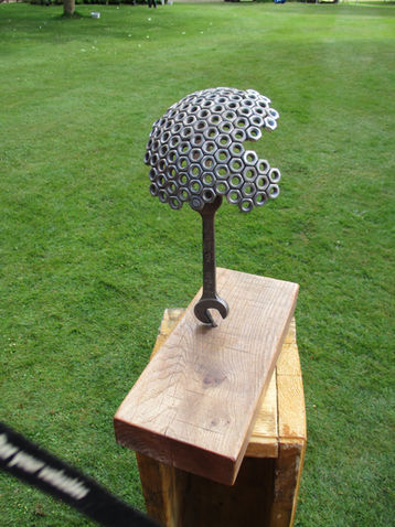 Contemporary metal sculpture with a dome-shaped honeycomb design, handcrafted from reclaimed materials by The Welding Carpenter in Kent