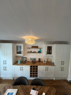 Fitted white Shaker style kitchen cupboards; 2 double door floor to ceiling units, 2 double door bas