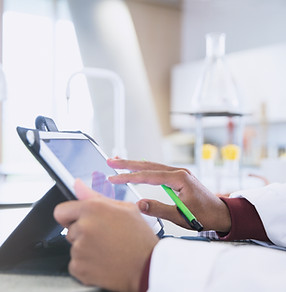 Community College researcher examines data that will be used to develop K-12 STEM lessons.