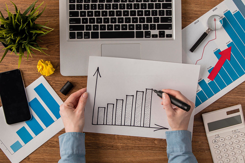 top-view-office-desk-with-calculator-growth-chart 2