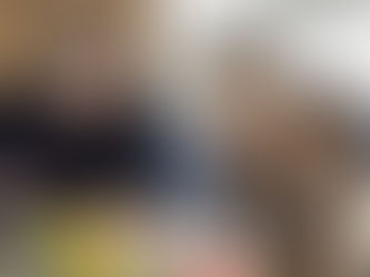 Teacher reviewing a learning worksheet with two young students at a table, representing trusted VPK-Approved Schools in Pembroke Pines focused on early education success.