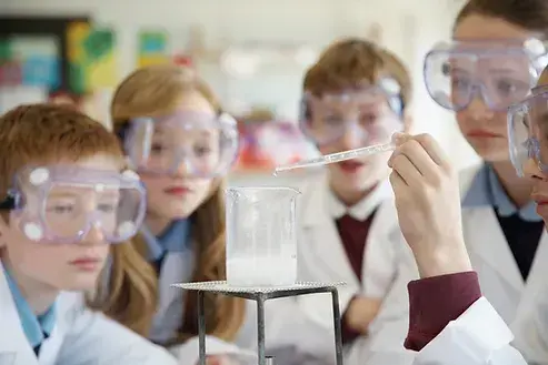 Preschooler Engaged in Colorful Science Experiment at NowTech Academy