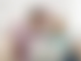 Parents reviewing enrollment documents together at home, discussing important questions before choosing an Aftercare Program for their child.