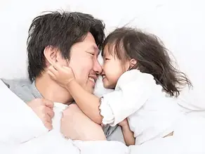 Father and daughter bonding at home after a fulfilling day at childcare, symbolizing the emotional benefits of early education in Pembroke Pines.