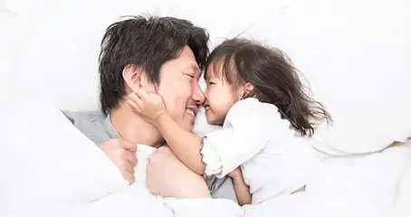 Father and daughter bonding at home after a fulfilling day at childcare, symbolizing the emotional benefits of early education in Pembroke Pines.
