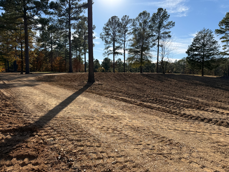 Compacted building pad graded and prepared for new construction in Central Arkansas