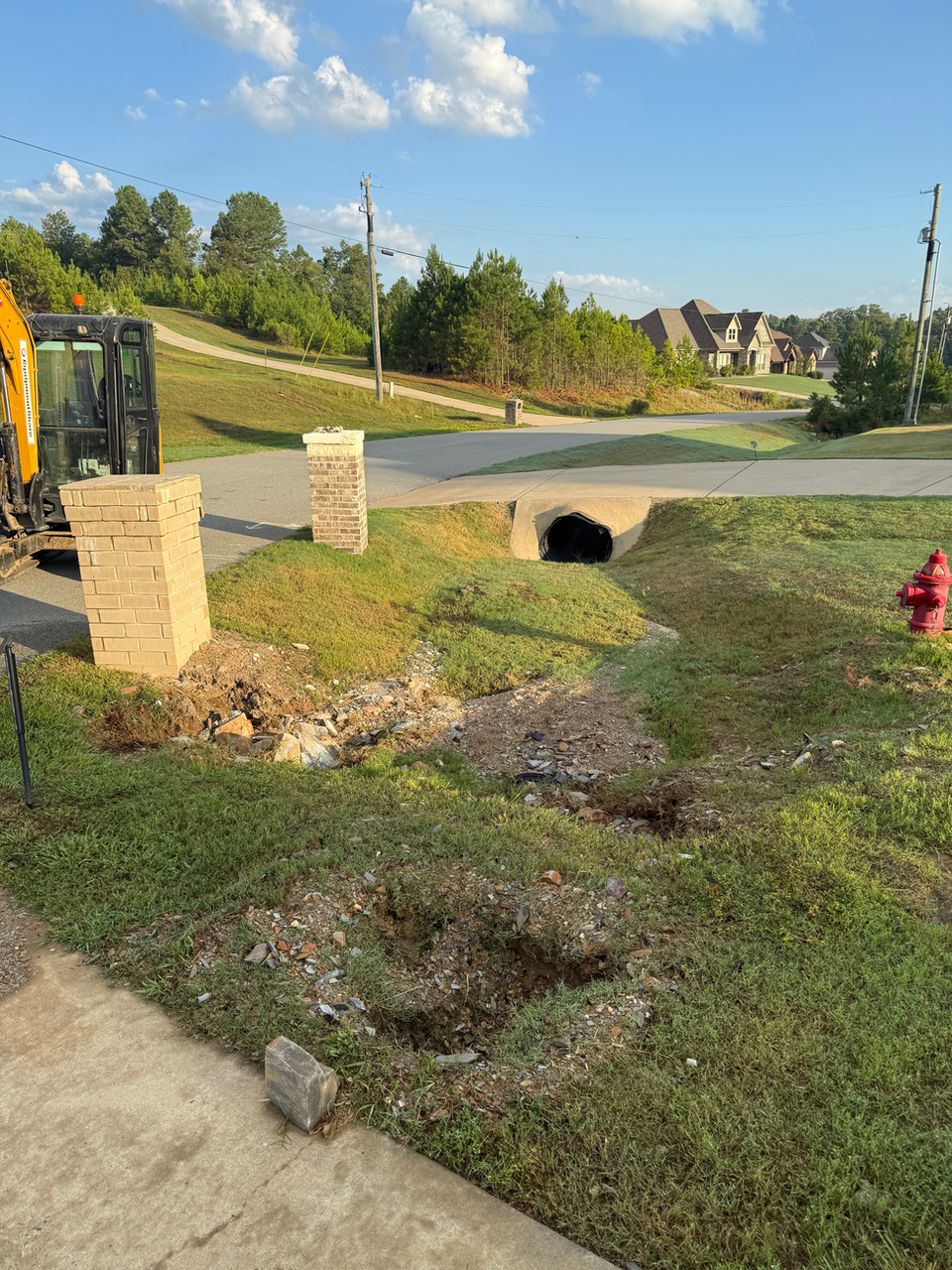 Damaged and blocked culvert before repair in Benton AR — Hyslip Excavation